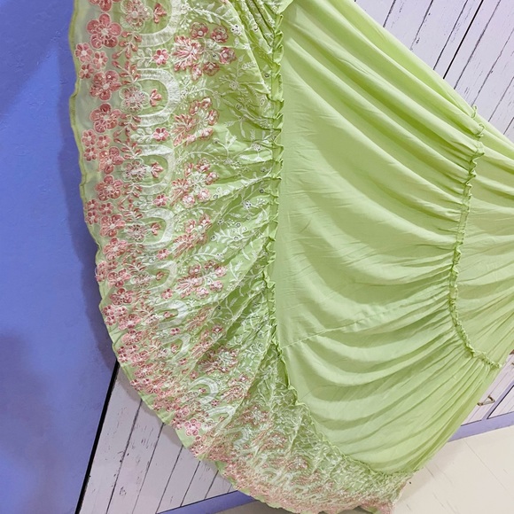 Full flaired beautifully embroidered pastel green gown for party wear - Picture 6 of 11